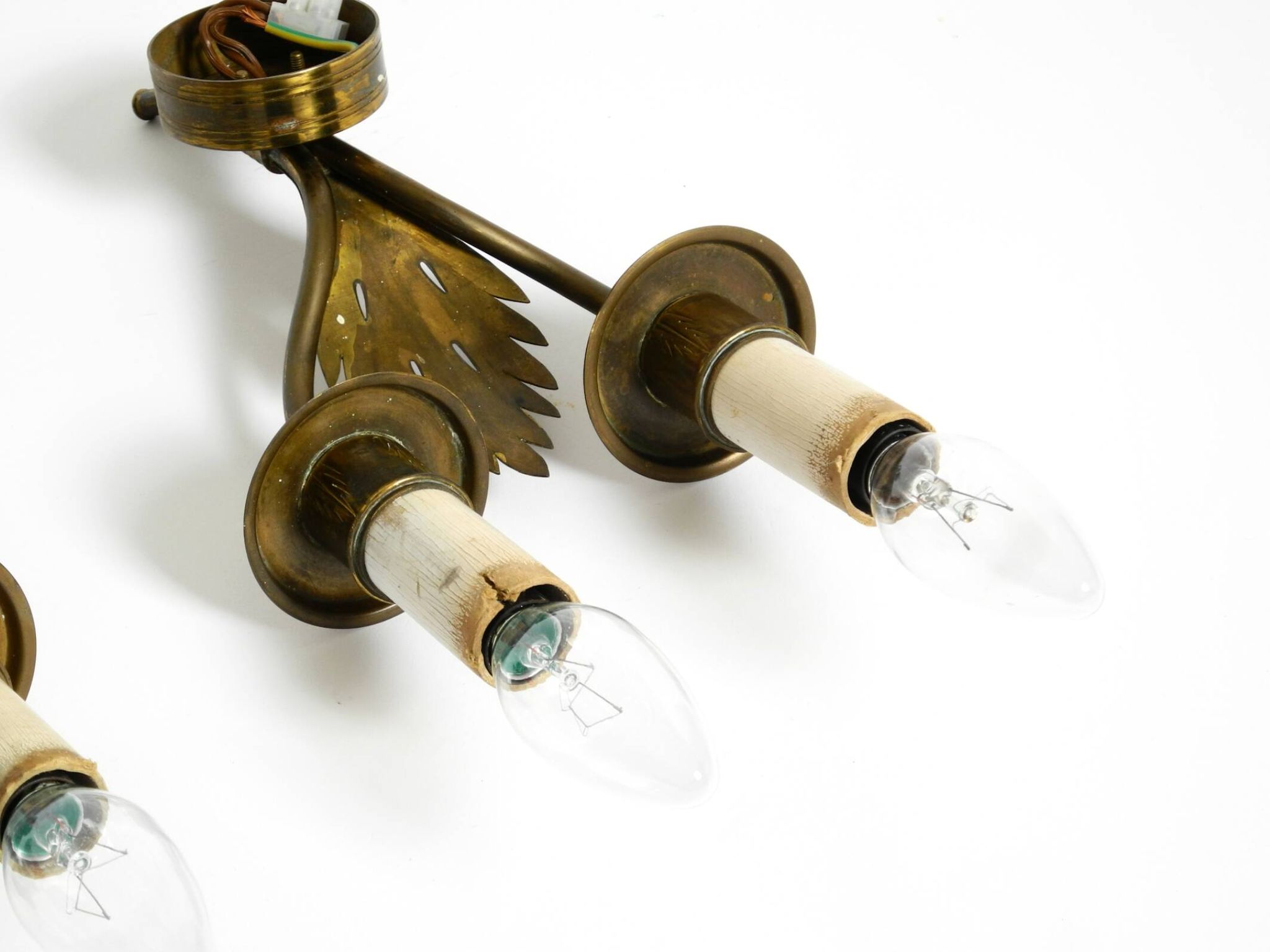 A pair of mid-century modern brass wall lamps by Vereinigte Werkstätten