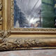 Old nineteenth century mirror in gilded wood and carved around 1850
