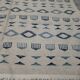 Handmade white and blue rug made of natural wool