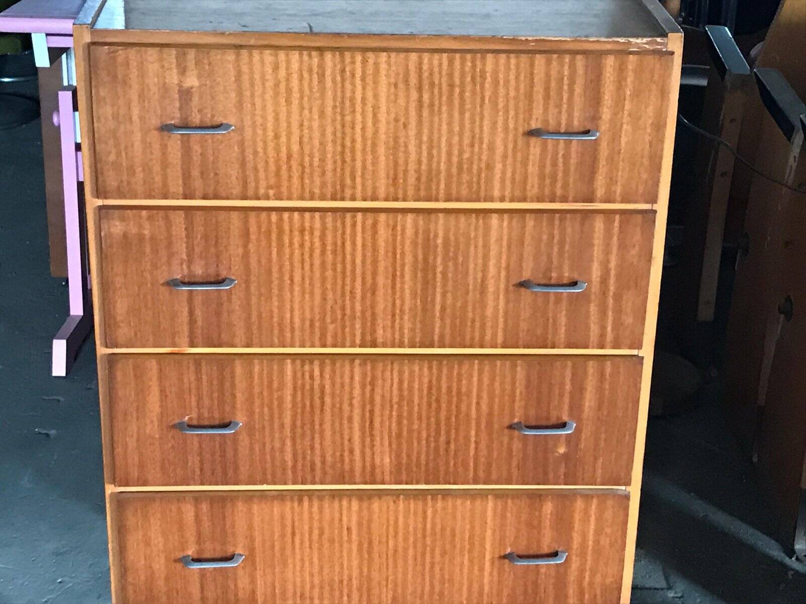 Vintage Scandinavian brown wooden chest of drawers with iron handles and 4 drawers, 1960s.