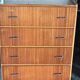 Vintage Scandinavian brown wooden chest of drawers with iron handles and 4 drawers, 1960s.