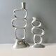 Pair of cast aluminum candle holders, design