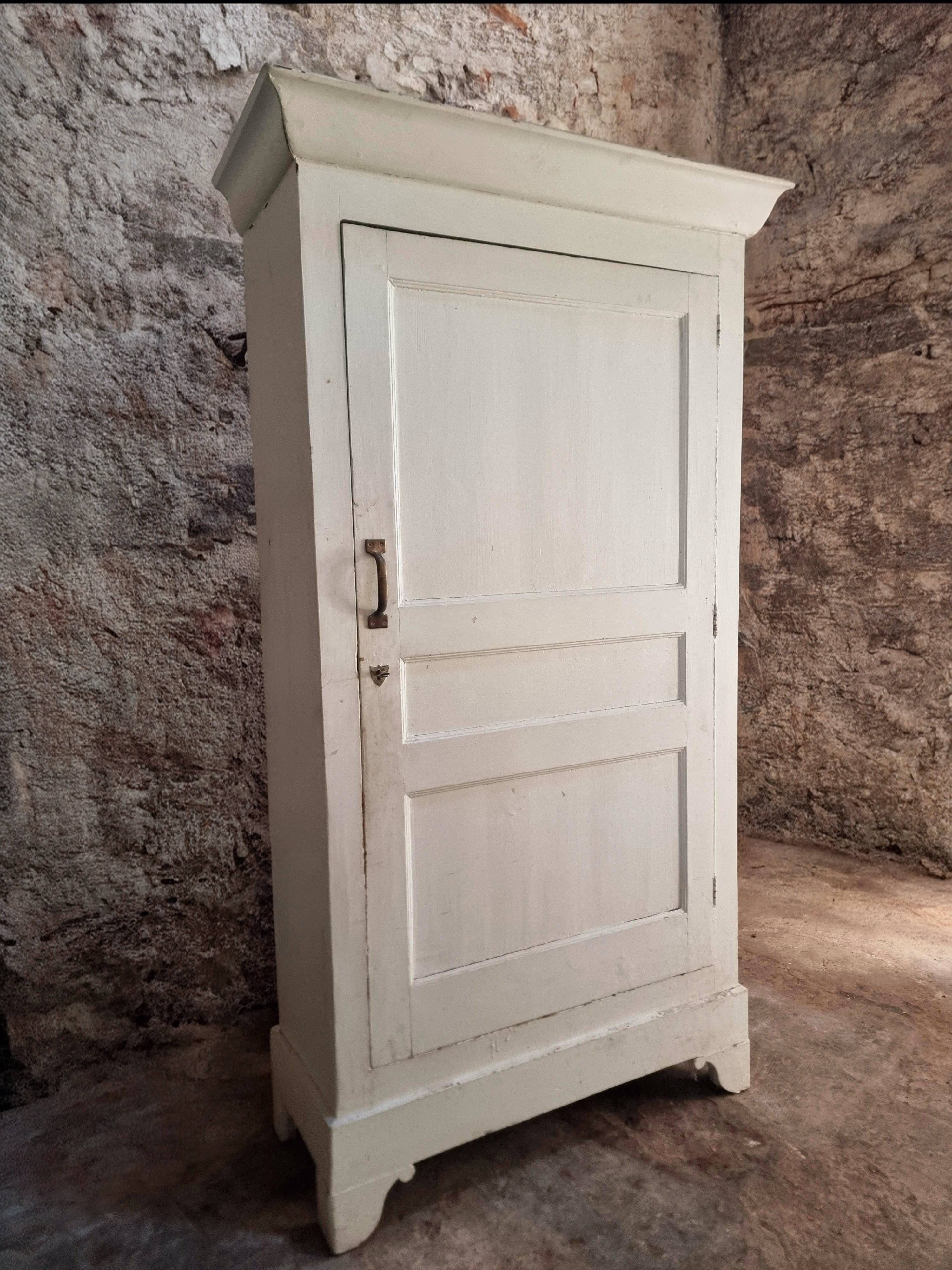 Antique French pine wardrobe with original white paint, circa 1900–1920.