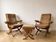 Pair of vintage 70s armchairs in brown and orange velvet with footrest.