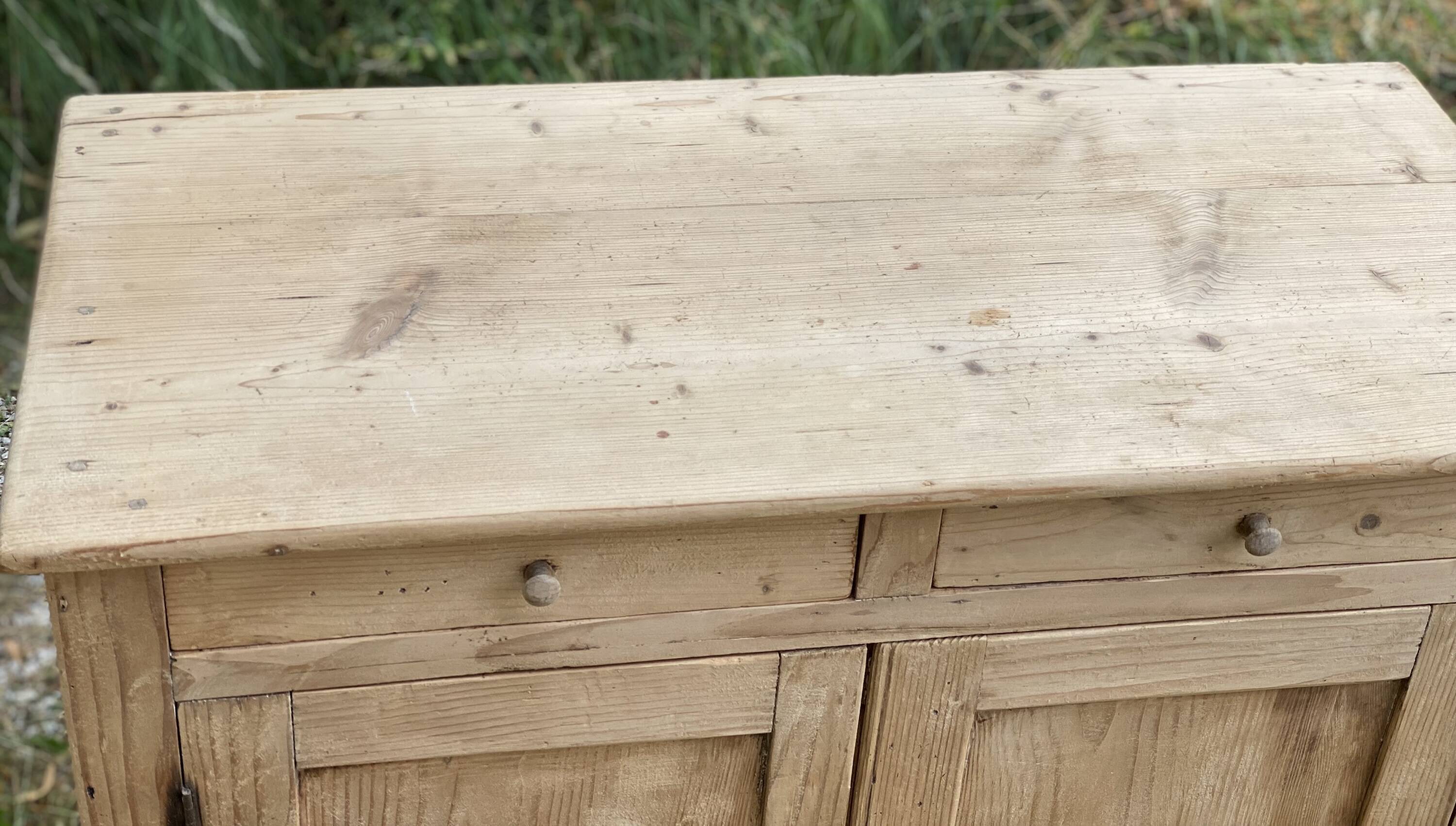 Small Parisian buffet with 2 doors and 2 drawers in light wood.