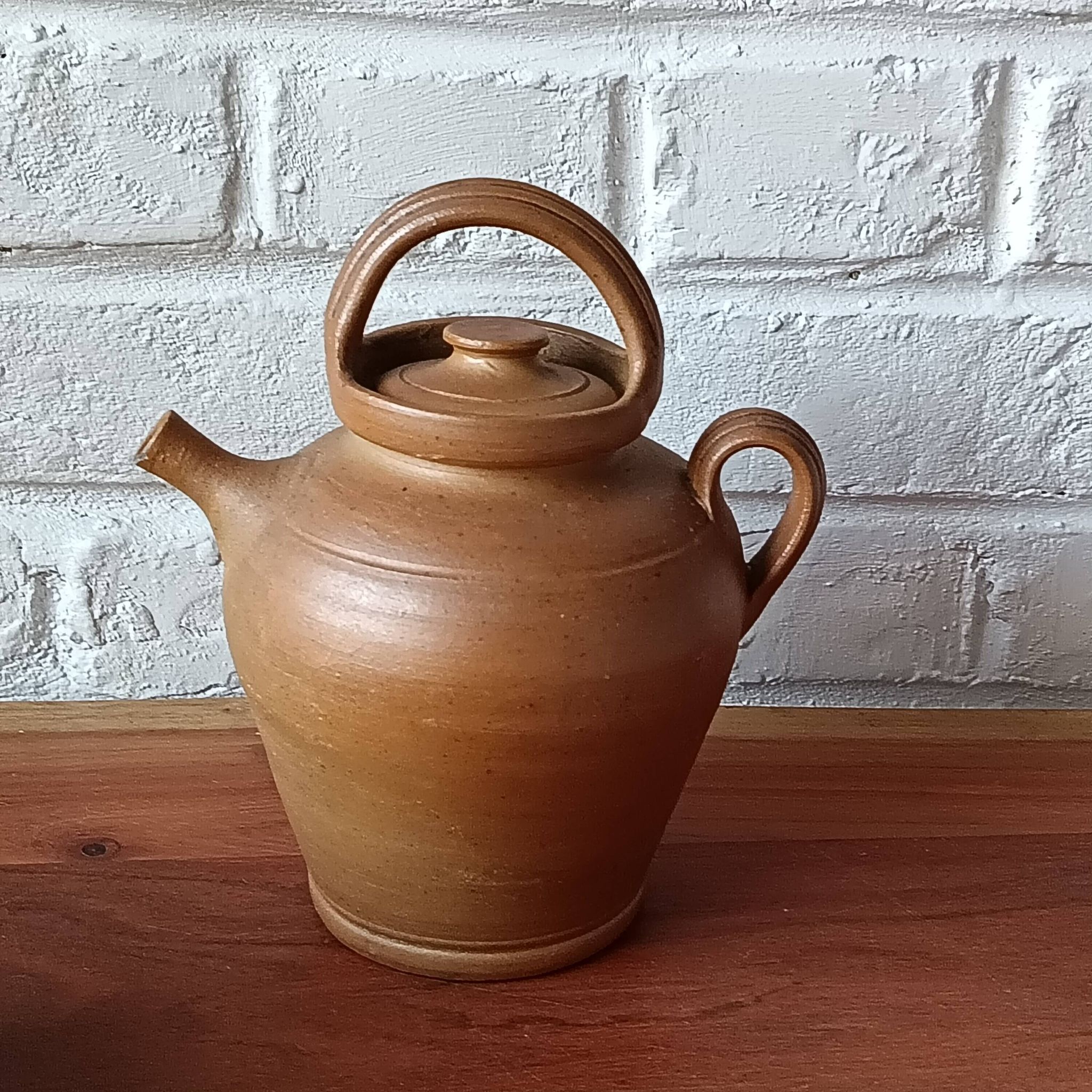 Vintage handmade brown glazed stoneware gargoulette.