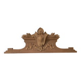 Old sandblasted wooden pediment