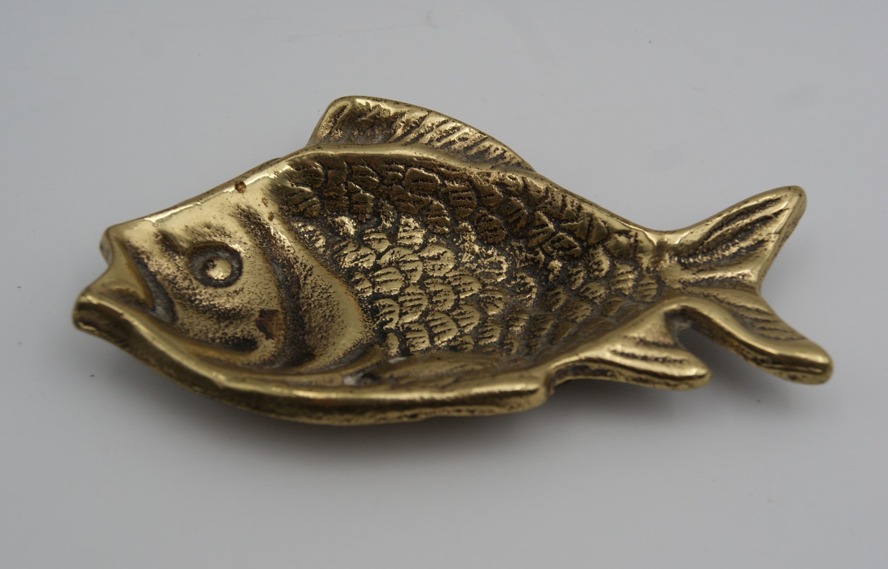 Empty bag brass fish England