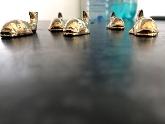 5 silver metal knife holders, whale