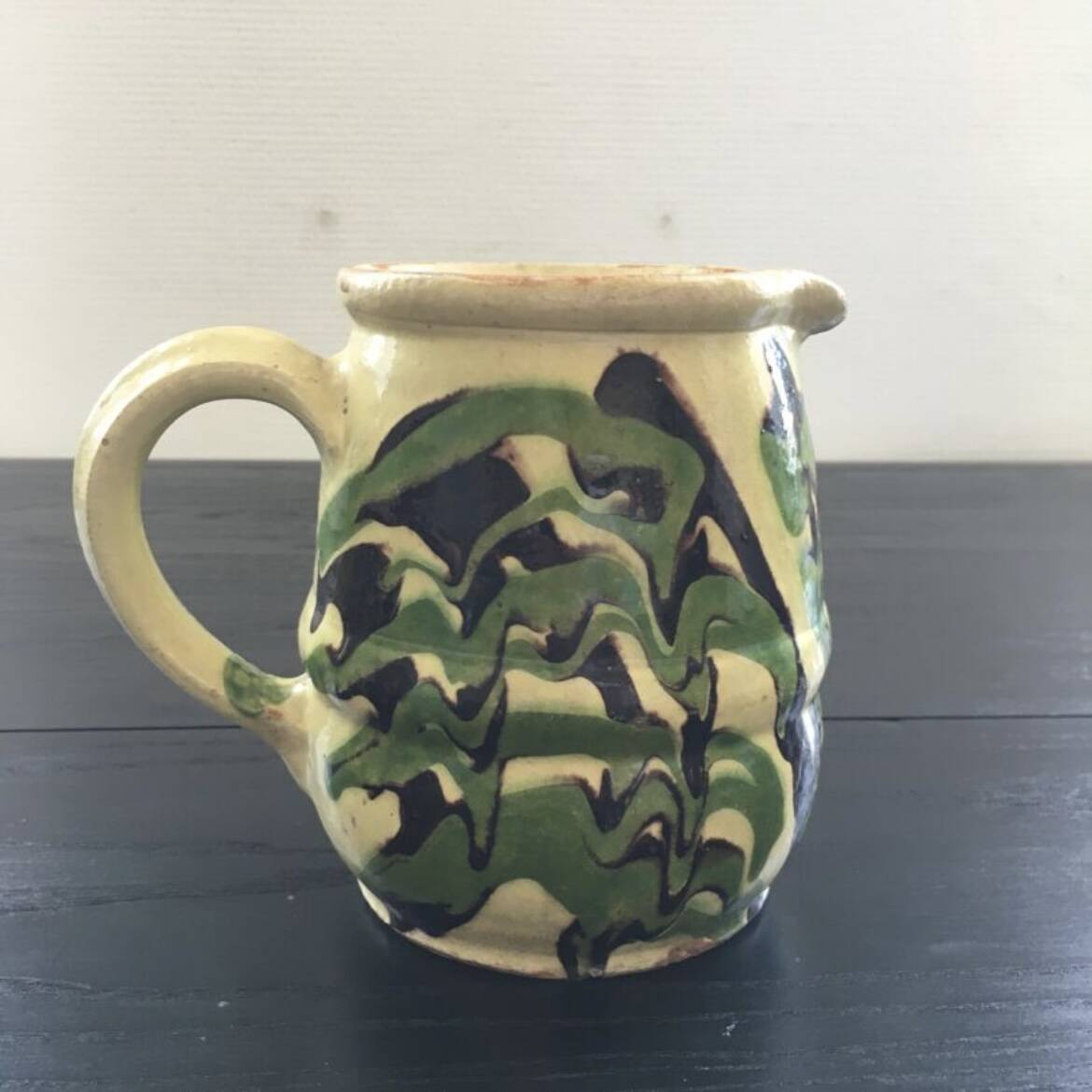 Antique pitcher of mixed earth