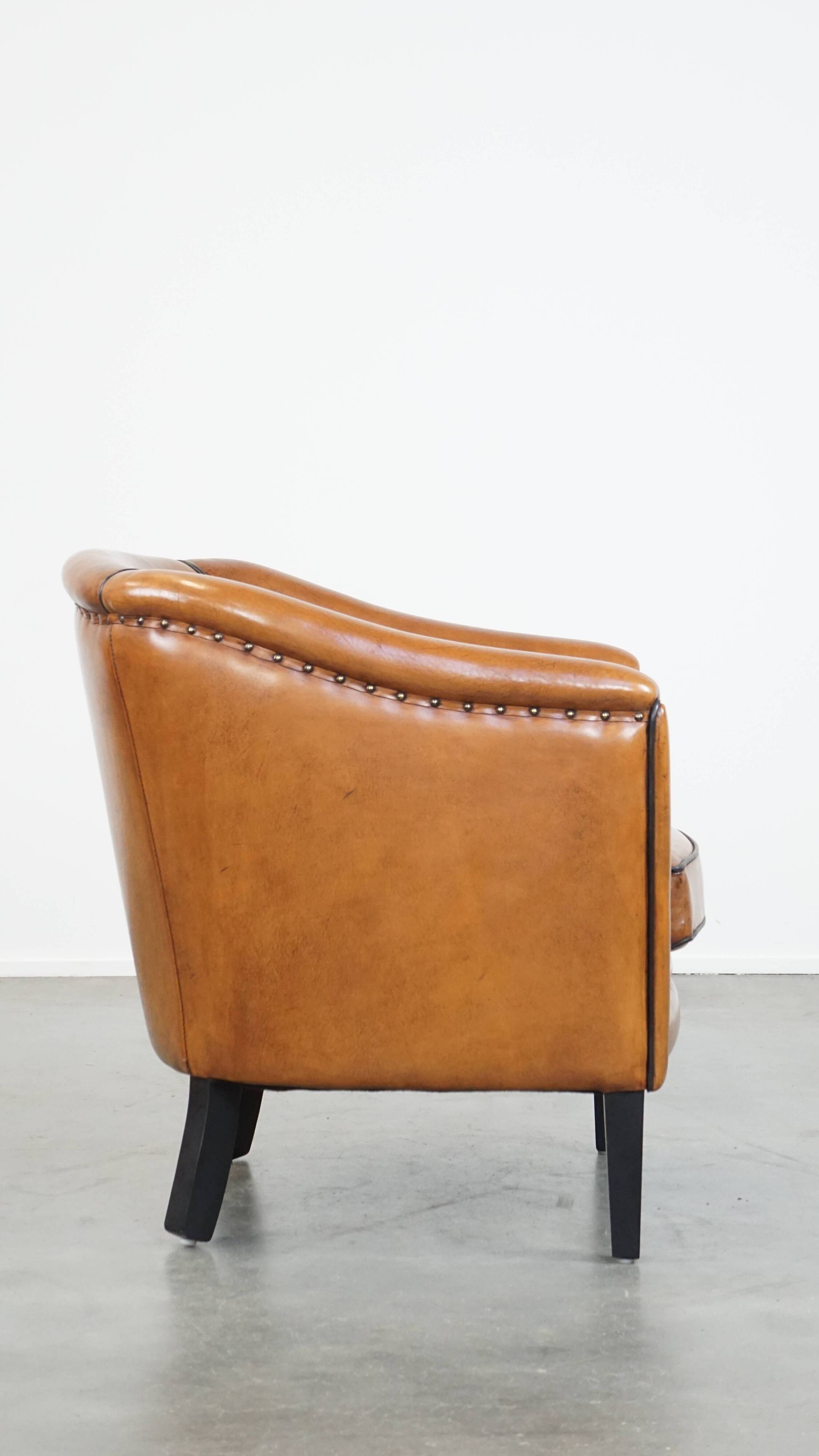 Sheep leather club chair finished with black piping