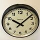 Black swiss industrial wall clock from inducta, 1960s