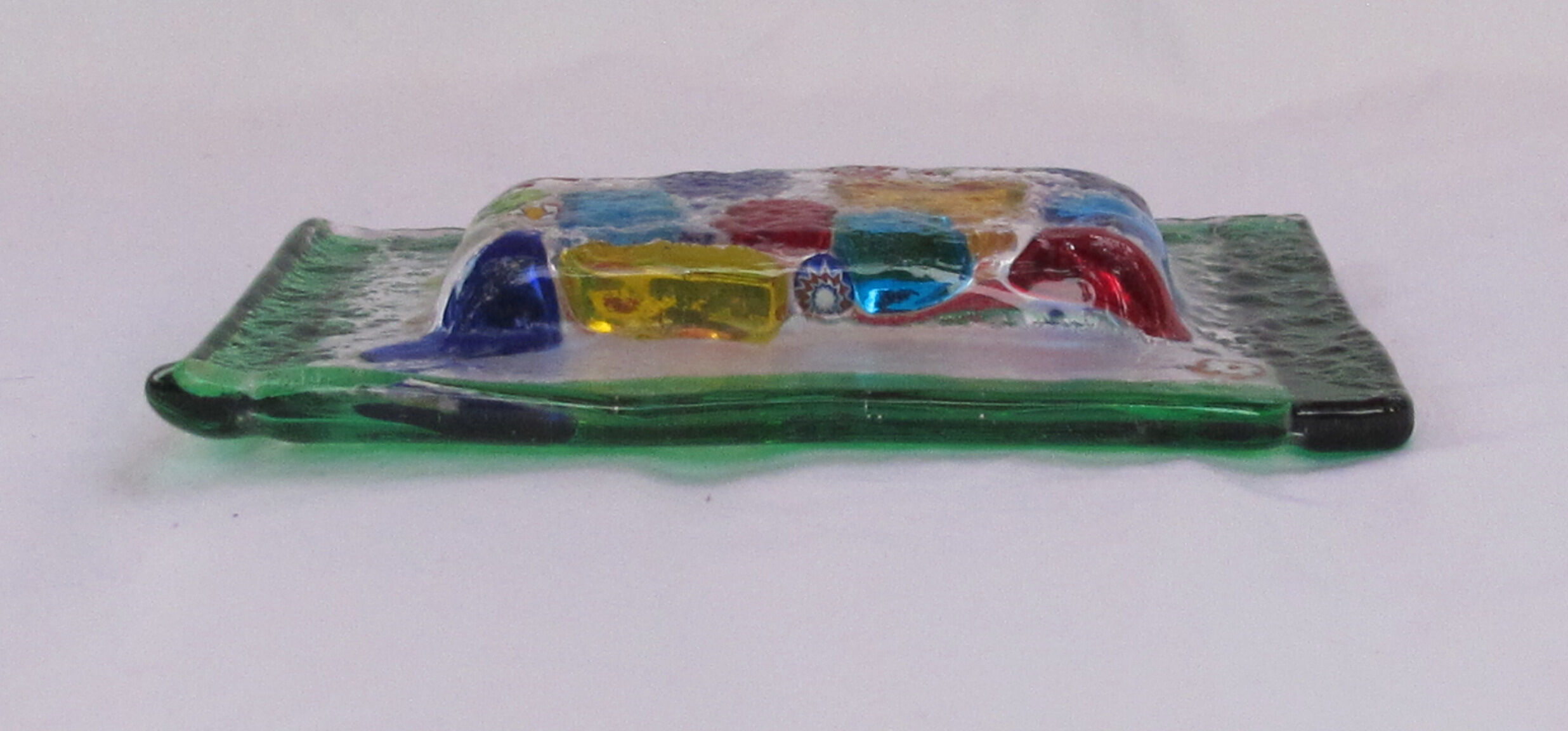 Empty millefiori-style glass pocket