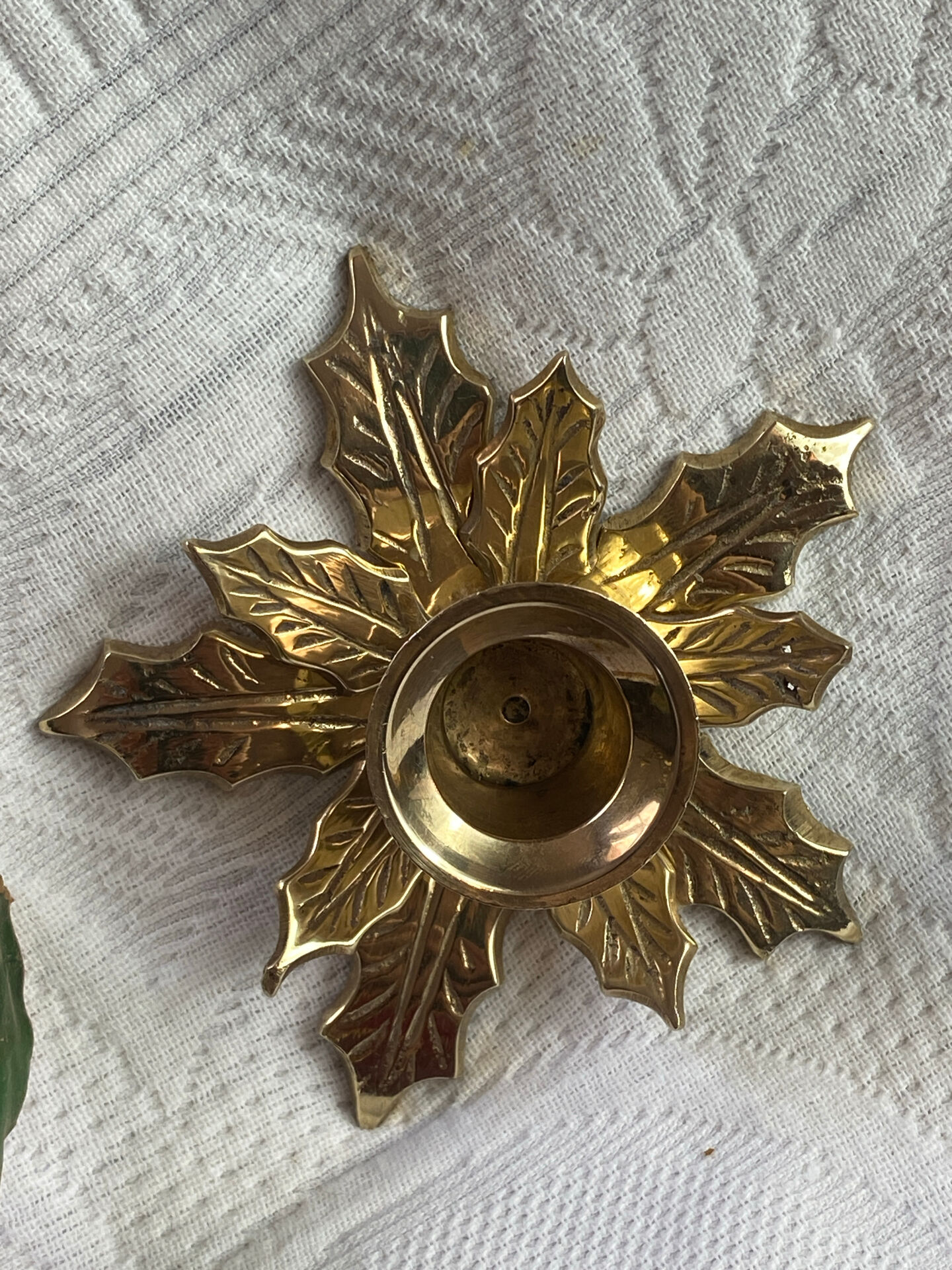 Pair of candlesticks, holly leaves, in brass