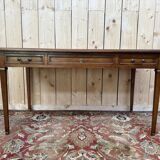 Bureau plat de style Louis XVI en merisier et cuir noir