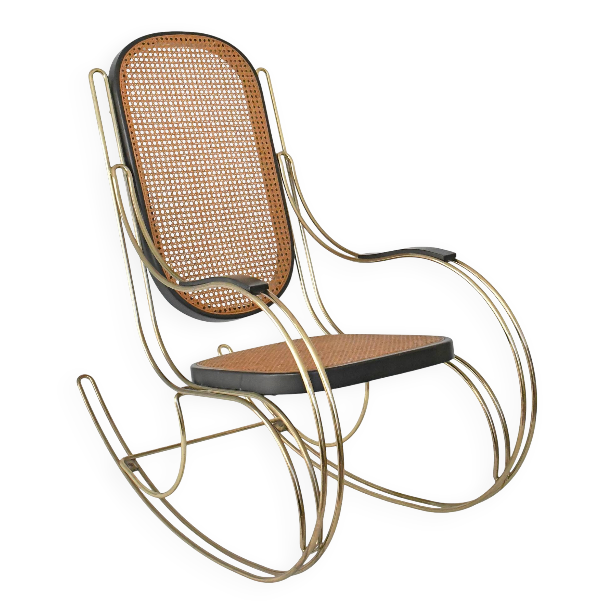 Modernist rocking chair in gilded brass and cane.
