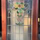 Late 19th century store doors, haberdashery front with Art Nouveau stained glass windows