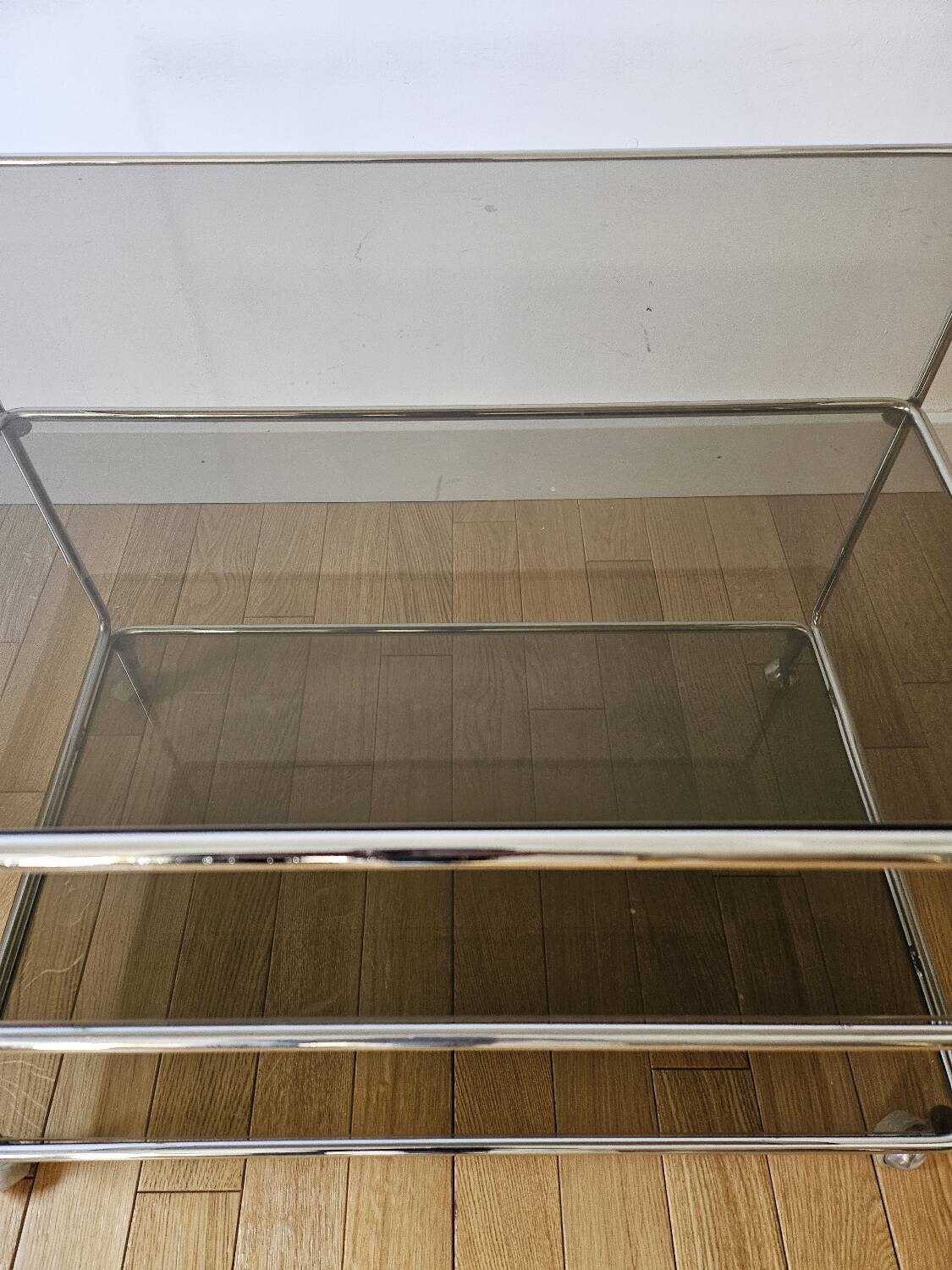 Small rolling trolley in chromed metal