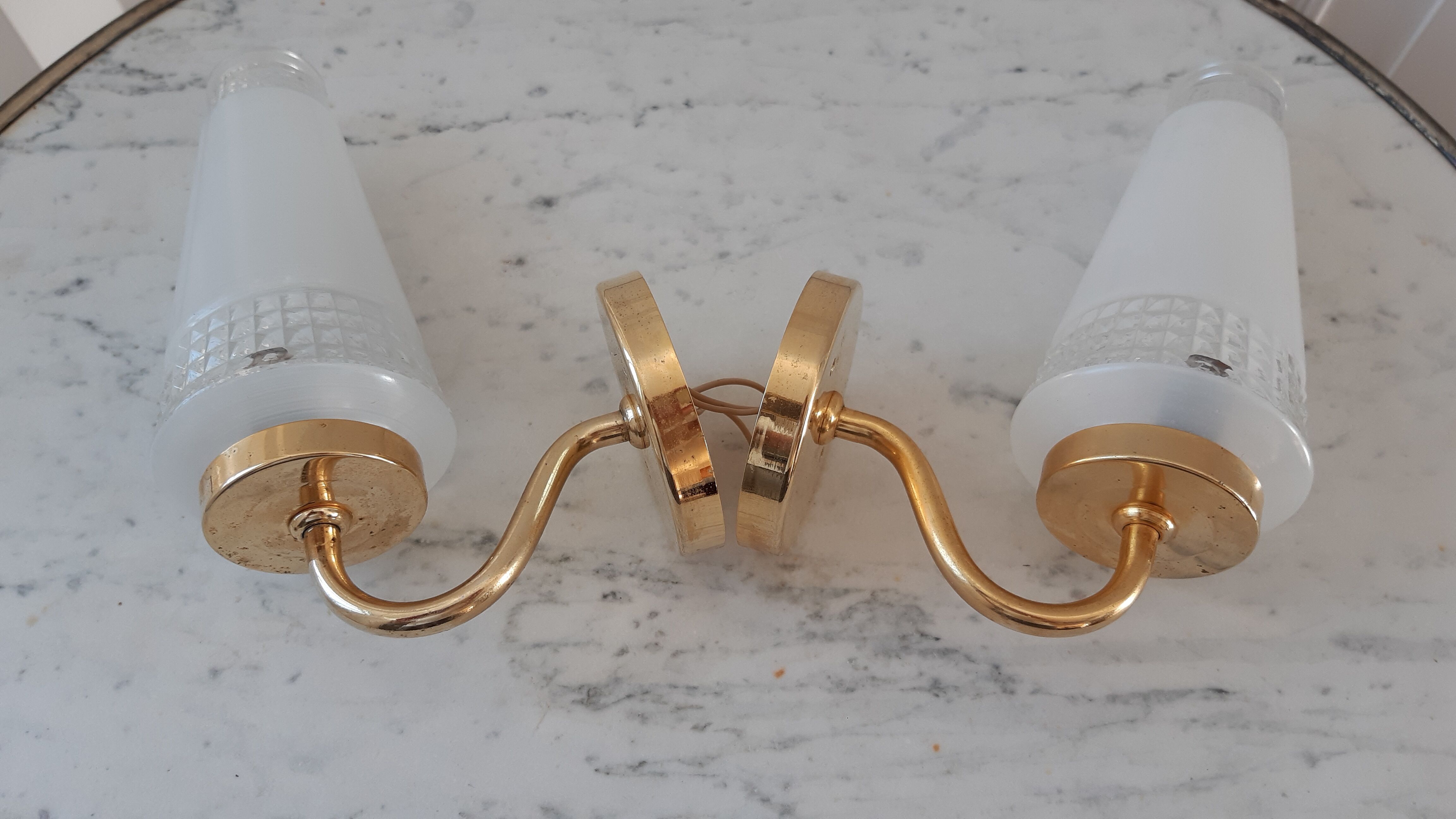 Pair of glass and gilded metal sconces 50s