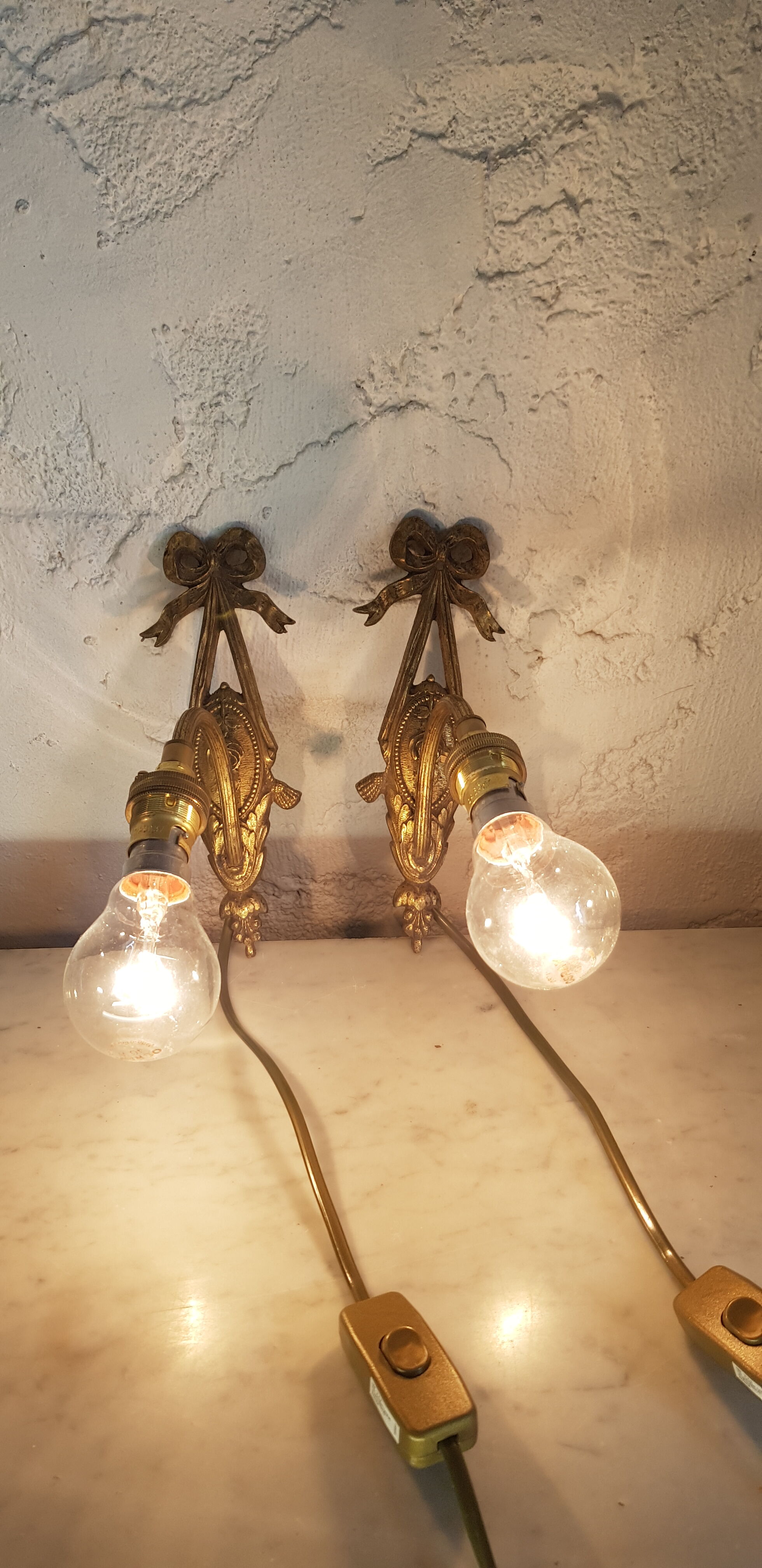 Pair of bronze wall sconces