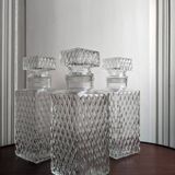 3 diamond-patterned chiseled glass carafes