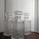 3 diamond-patterned chiseled glass carafes