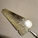 Shovel has silver metal pie art deco