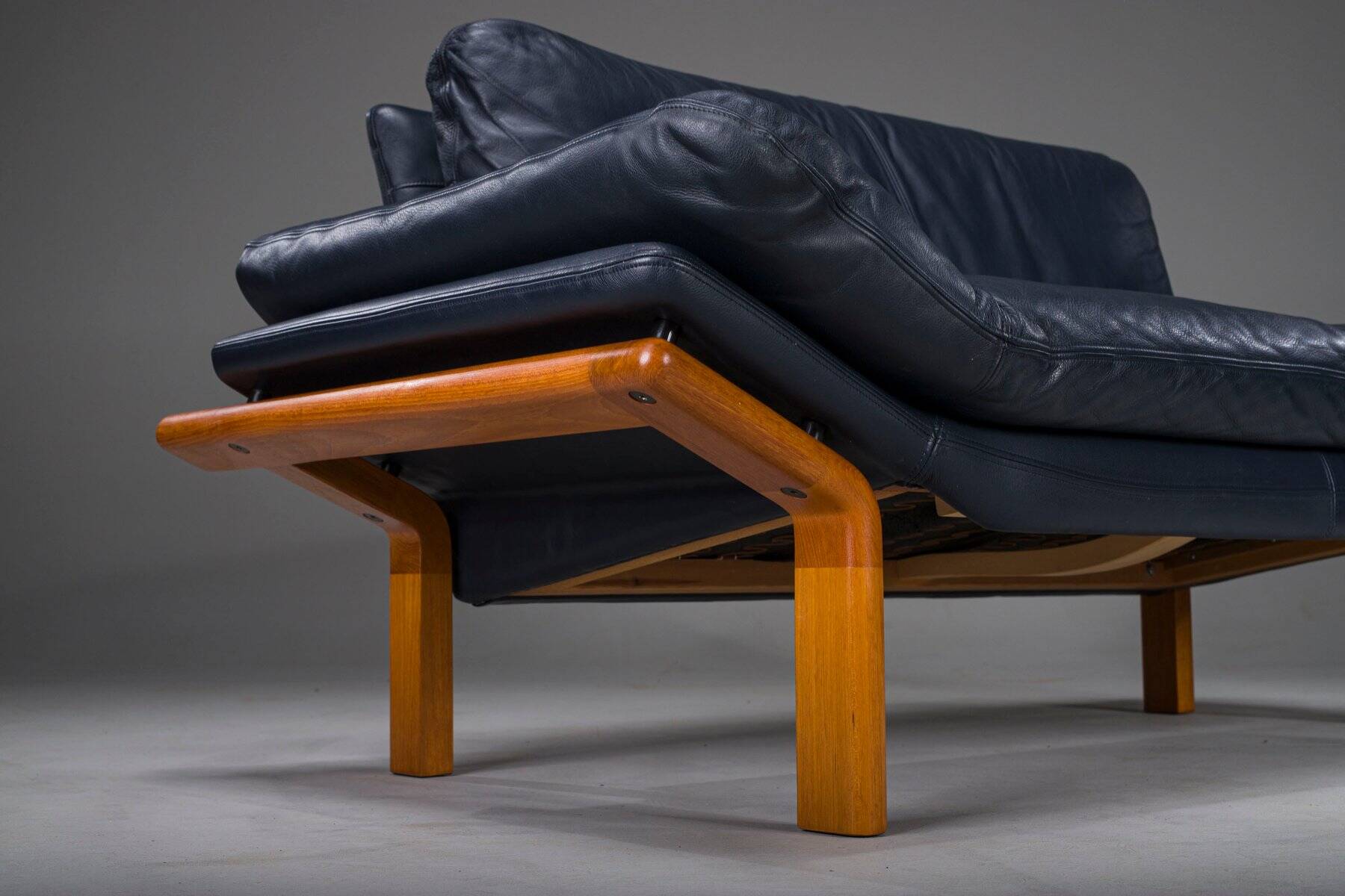 Danish teak and navy blue leather 2-seater sofa from Komfort, 1970s