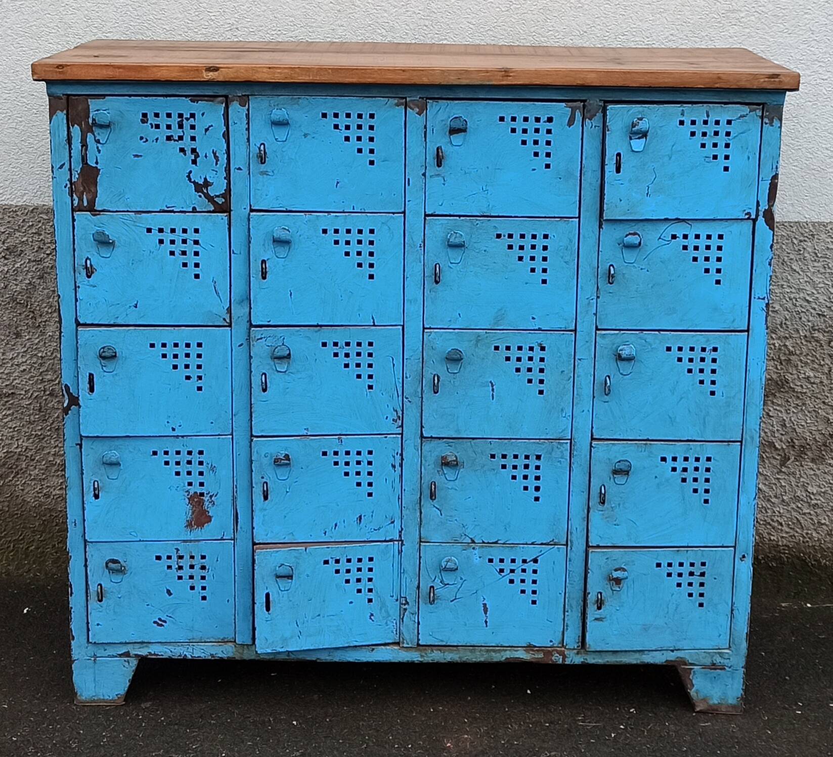 Old blue metal locker with wooden top