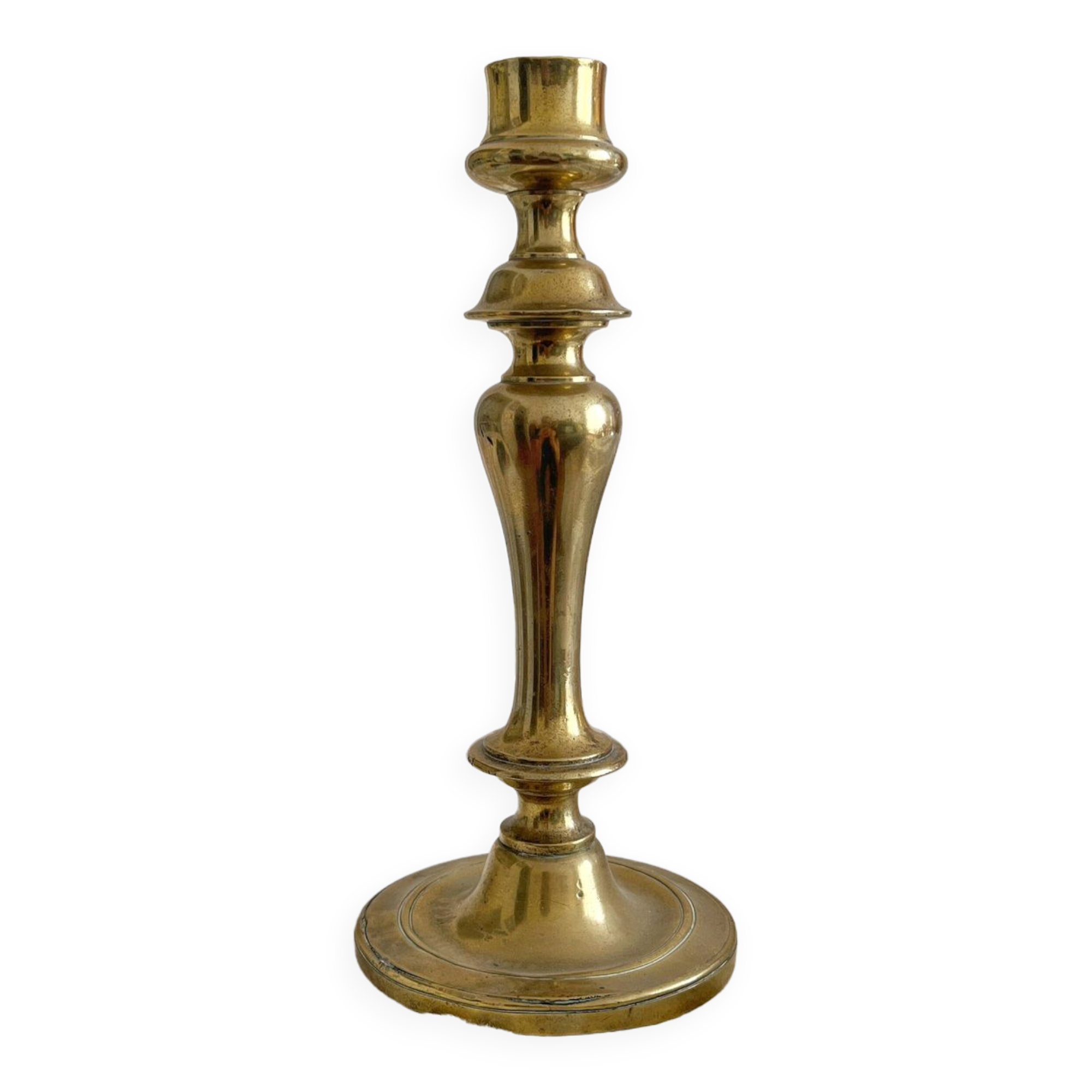 Antique brass candlestick in vintage baluster shape