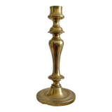 Antique brass candlestick in vintage baluster shape