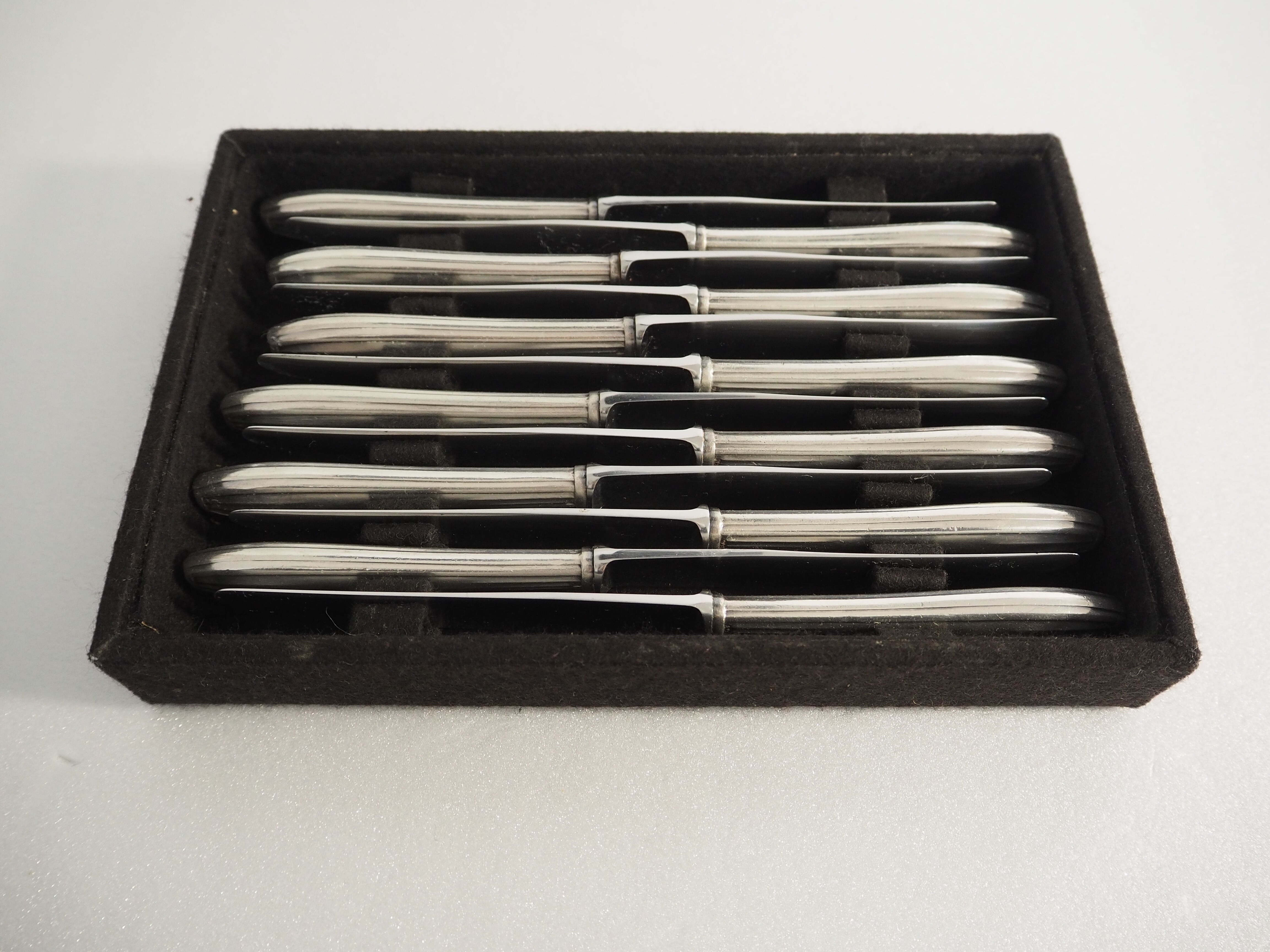 12 SFAM cheese knives in its dark chocolate case