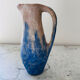 Set of artisanal pitcher and weathered cups