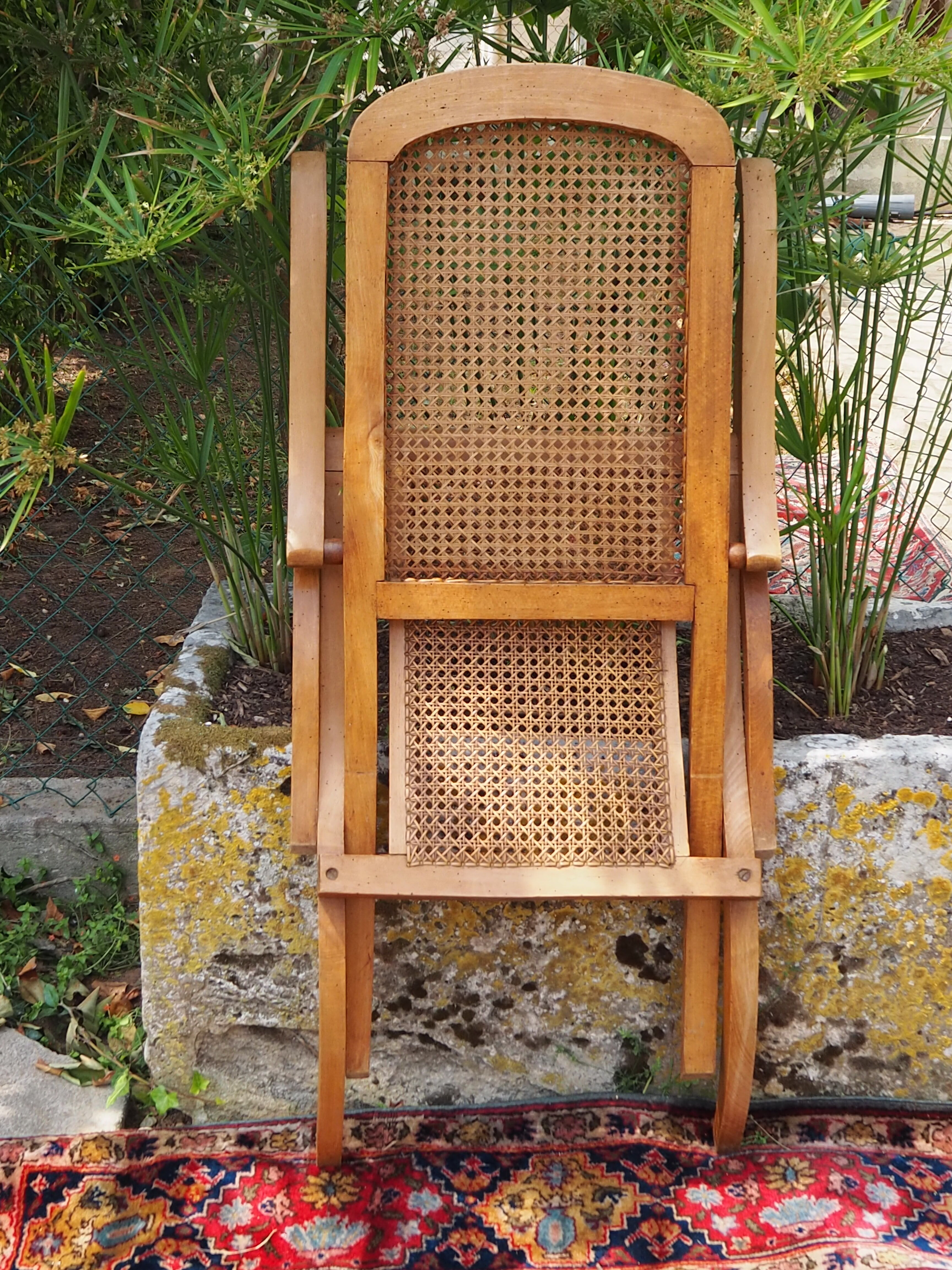 Cane folding armchair in solid wood