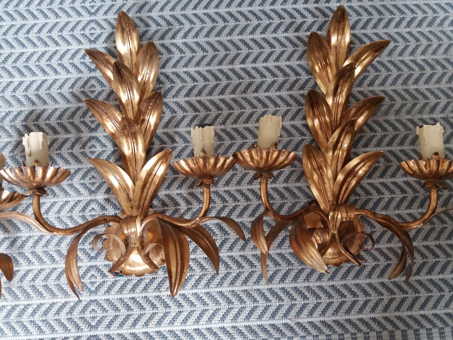 Pair of vintage golden sheet metal wall lights with leaf decoration