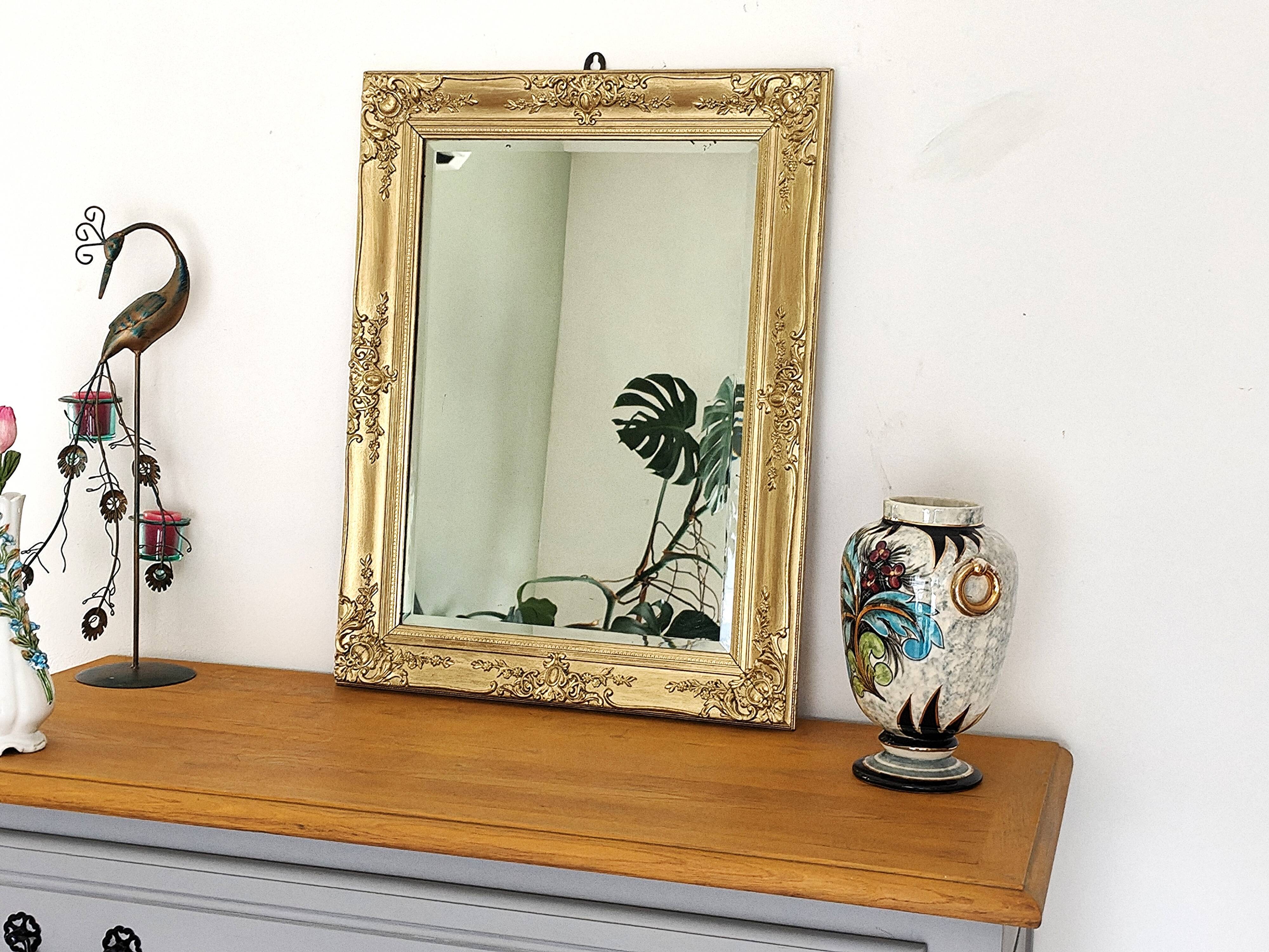 Richly carved antique gilded mirror