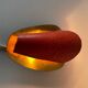 Pair of orange plexiglass and curved brass wall lights, 1950s, Germany