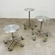 3 adjustable industrial stools with aluminum wheels