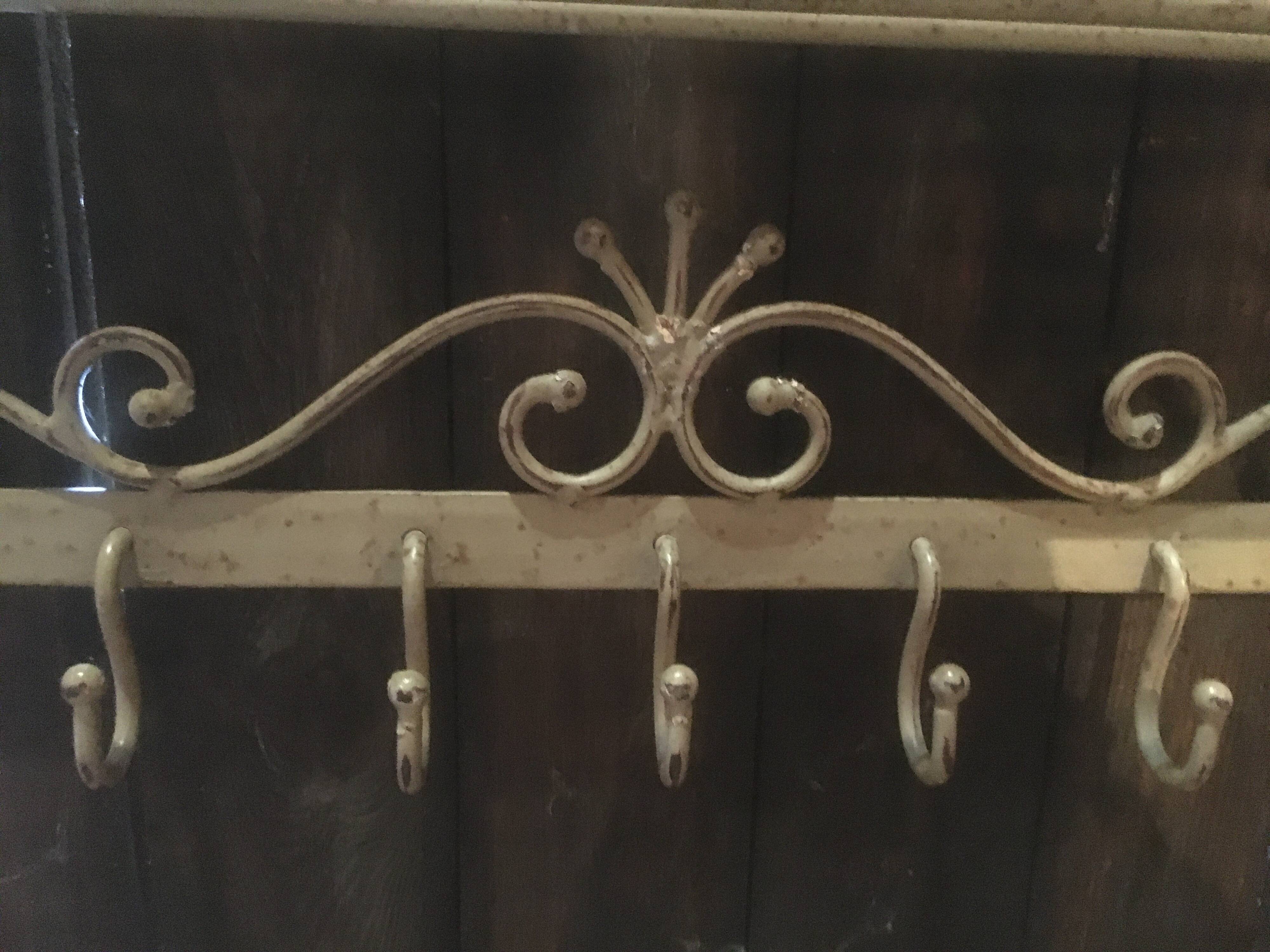 White wrought iron coat and hat rack