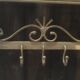 White wrought iron coat and hat rack