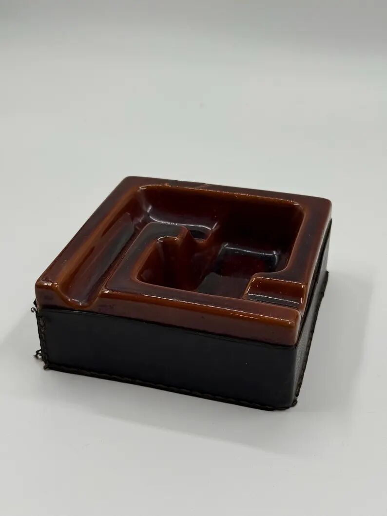 Geometric brown enamelled ashtray with a leather base (1960s-70s)