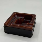 Geometric brown enamelled ashtray with a leather base (1960s-70s)
