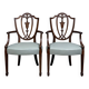 Paire de fauteuils en bois sculpté de style néoclassique, début XIXe