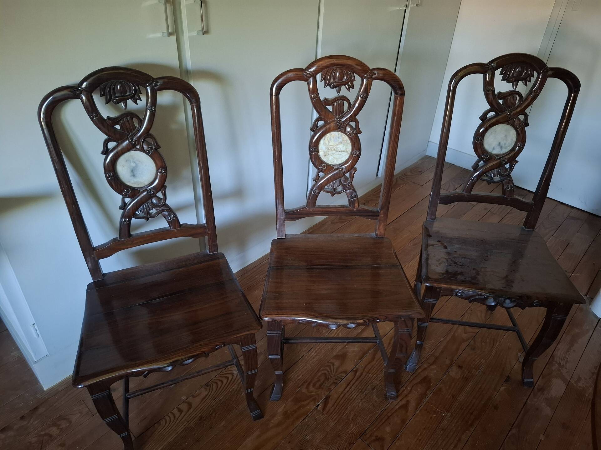 Sculpted chairs in solid wood