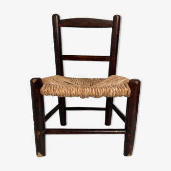 Wooden children's chair with vintage straw seat