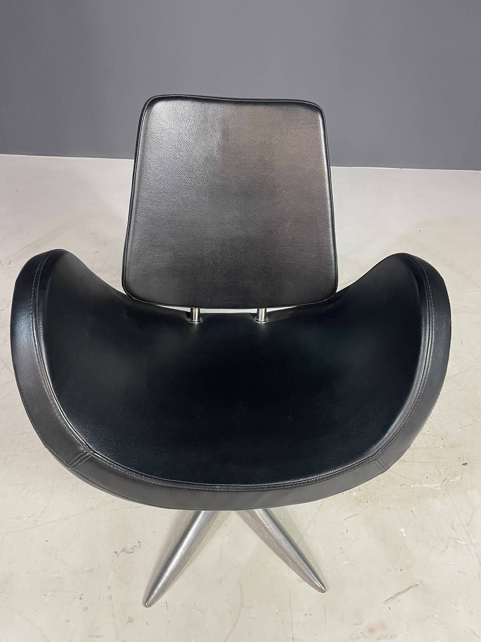 Alipes black swivel salon chair with chrome star base by Giorgetto Giugiaro