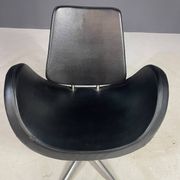 Alipes black swivel salon chair with chrome star base by Giorgetto Giugiaro