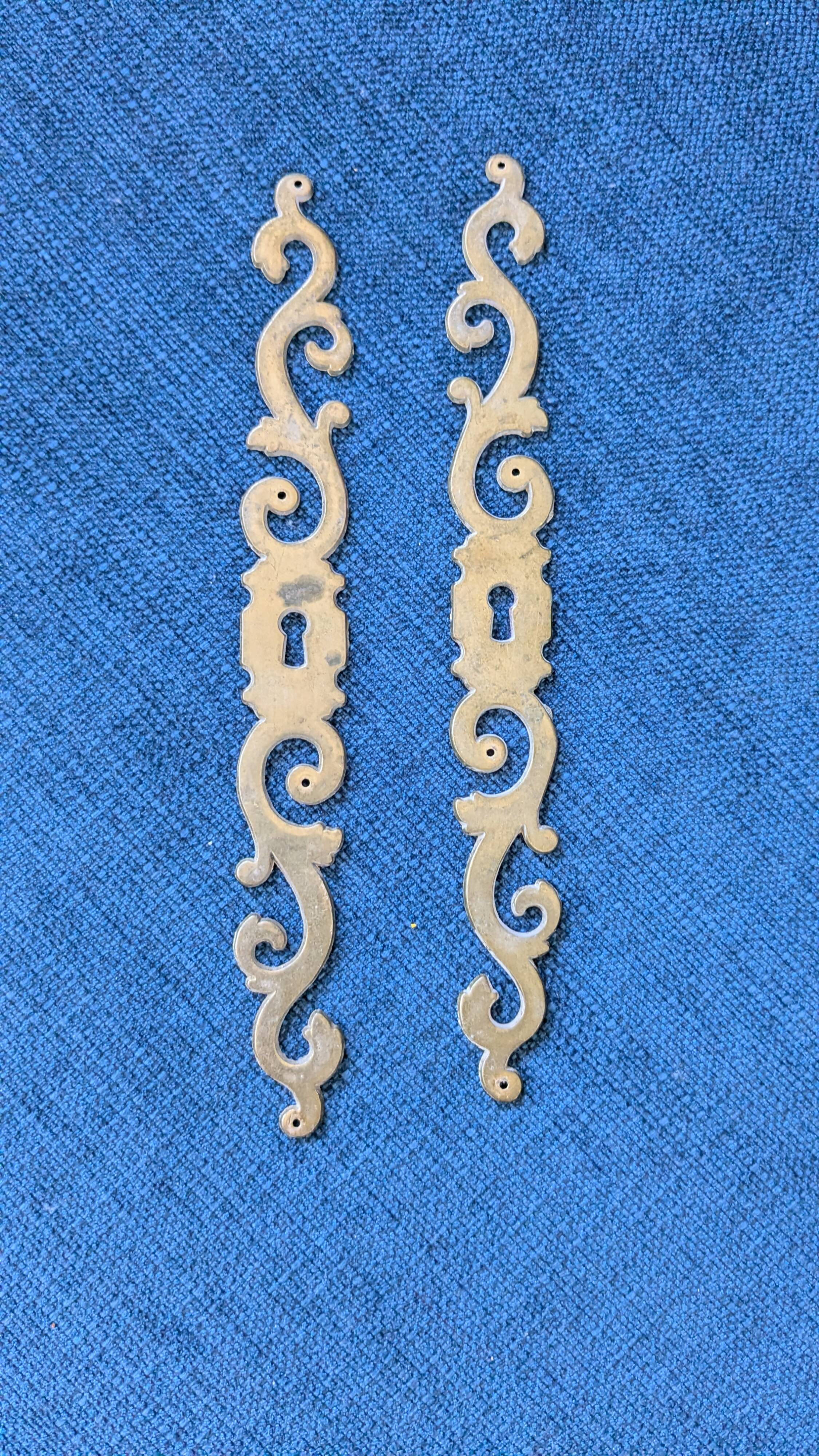Pair of brass keyholes