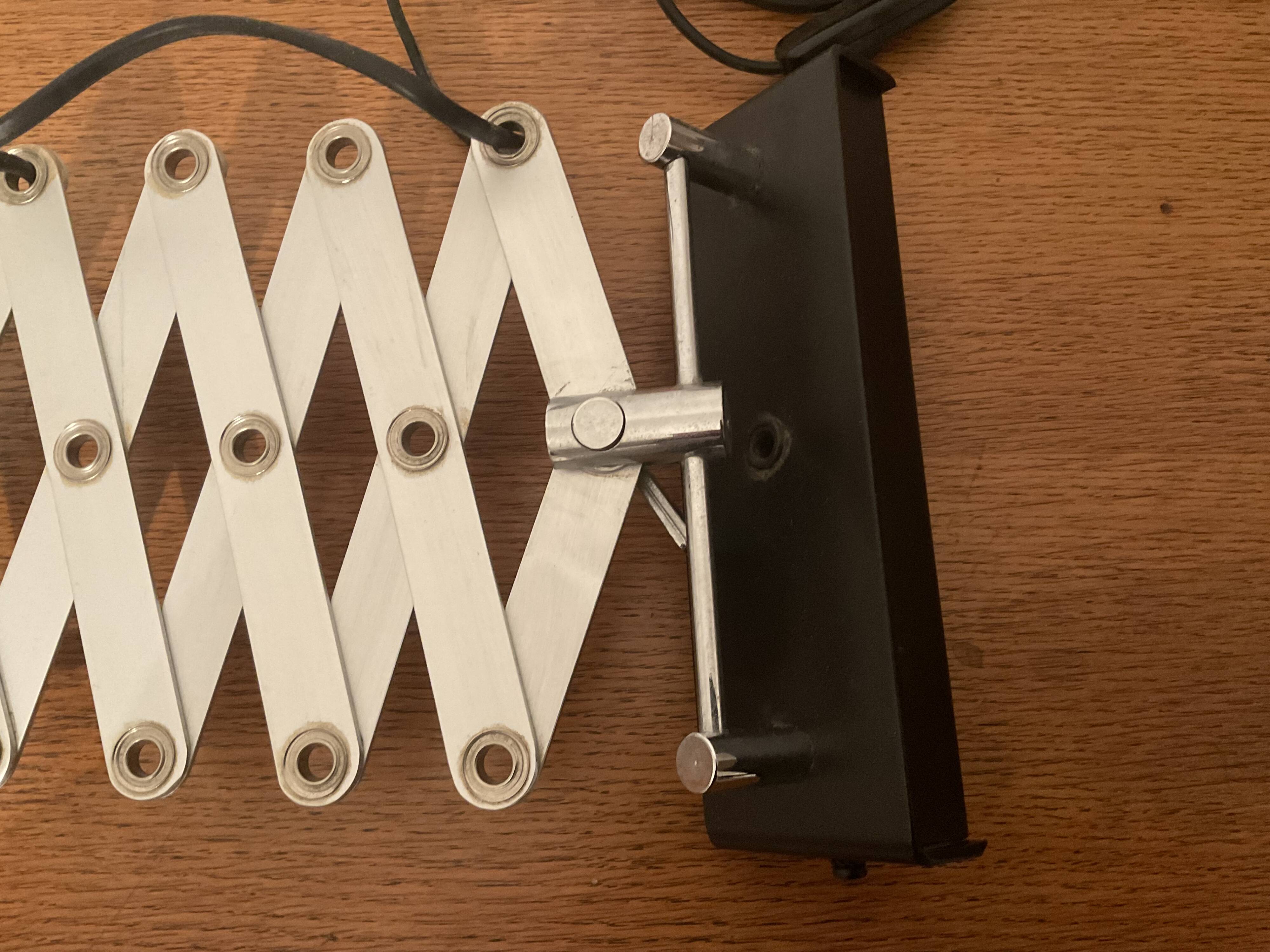 Industrial accordion wall light