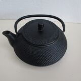 Black cast iron teapot